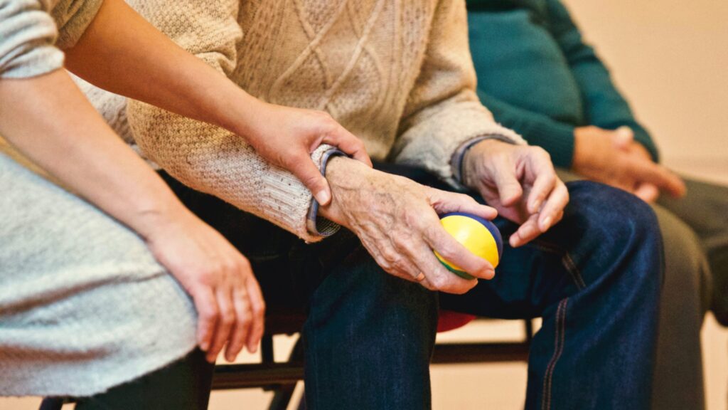 Helper lending a hand to an elderly person